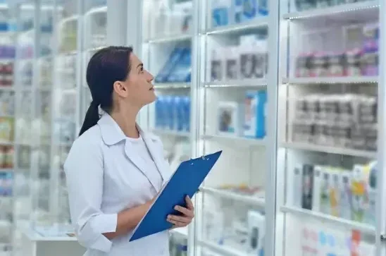pharmacist-checking-medicines-drugstore 1